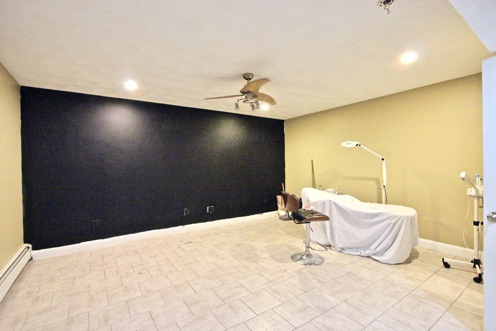 70 Summer Street Stoneham, MA 02180 - Photo 22 of 30 a bed room with a bed