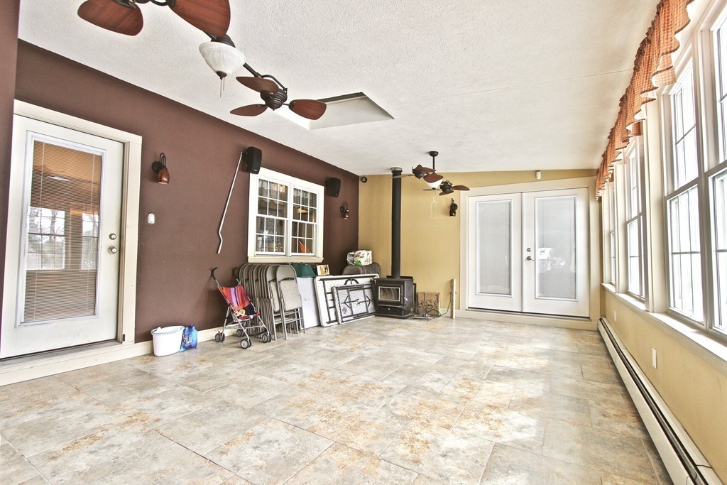 70 Summer Street Stoneham, MA 02180 - Photo 25 of 30 a view of a livingroom with wooden floor and furniture