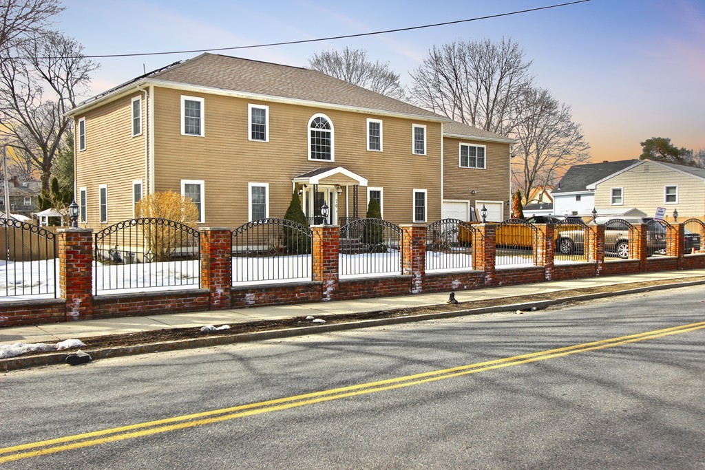 70 Summer Street Stoneham, MA 02180 - Photo 3 of 30 a front view of a house with a road