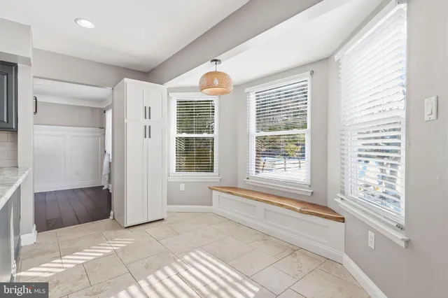 a view of bathroom with bathtub and windows