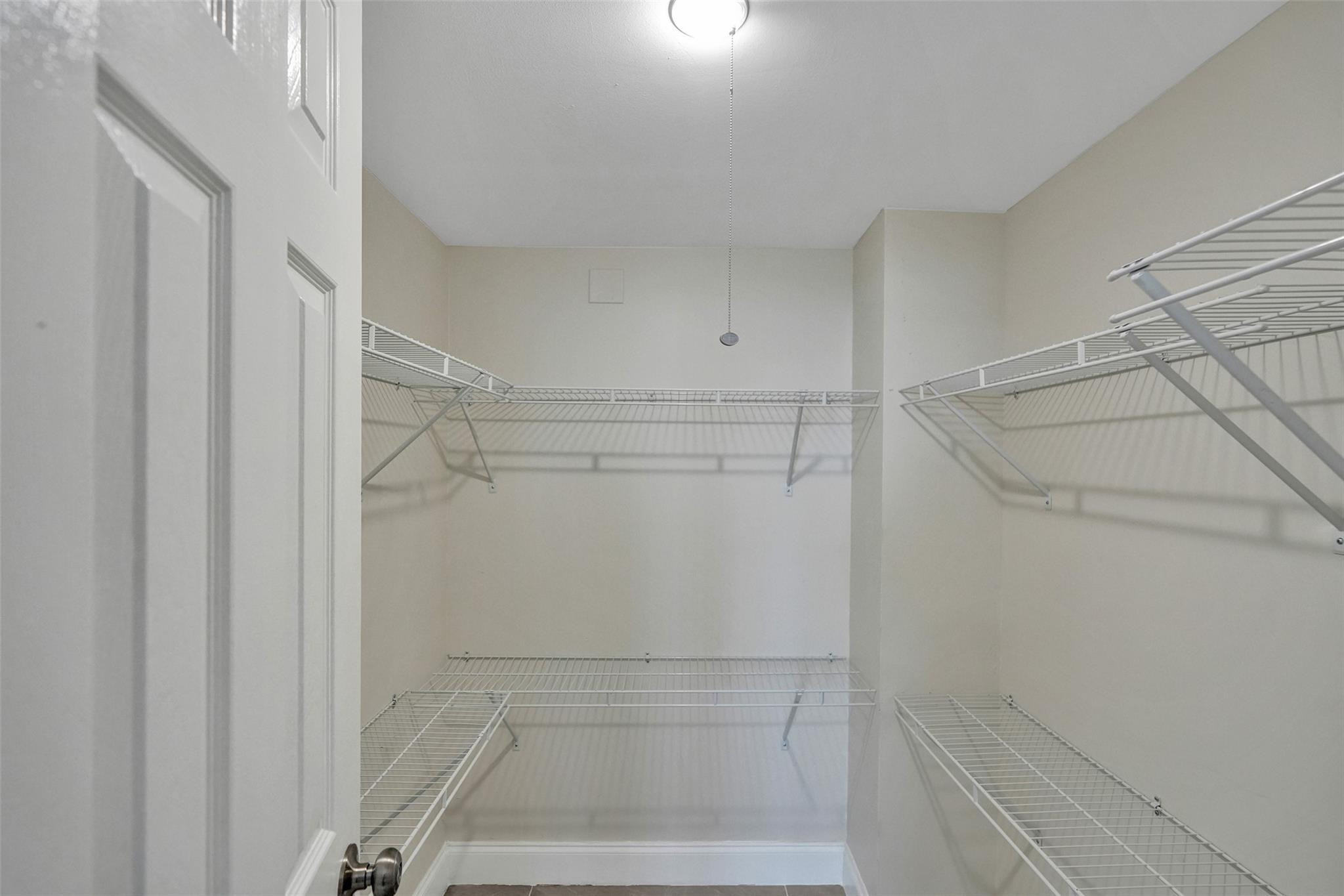 4222 Inverrary Boulevard, Unit 4810 Lauderhill, FL 33319 - Photo 39 of 63 a view of walk in closet with empty racks