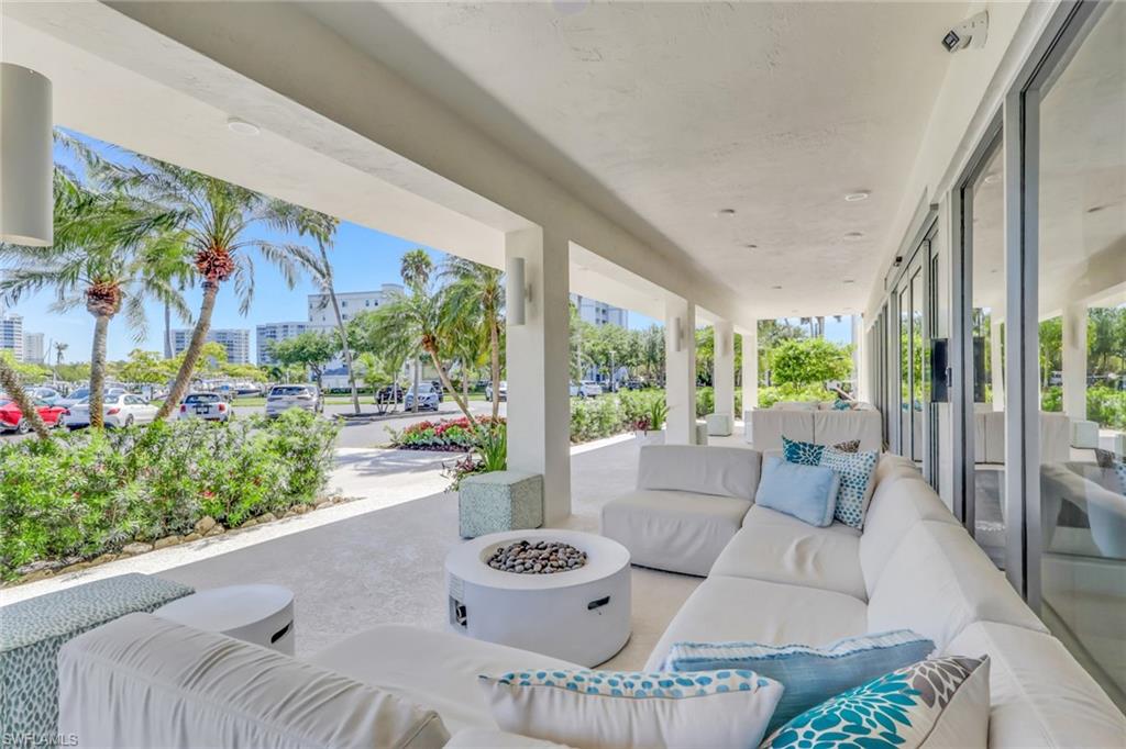 1 Bluebill Avenue, Unit 709 Naples, FL 34108 - Photo 26 of 30 a outdoor living space with furniture and garden view