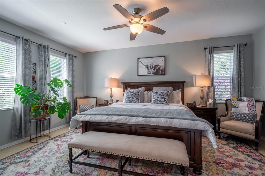 309 Royal Bonnet Drive Apollo Beach, FL 33572 - Photo 14 of 59 a bedroom with a bed and a couch