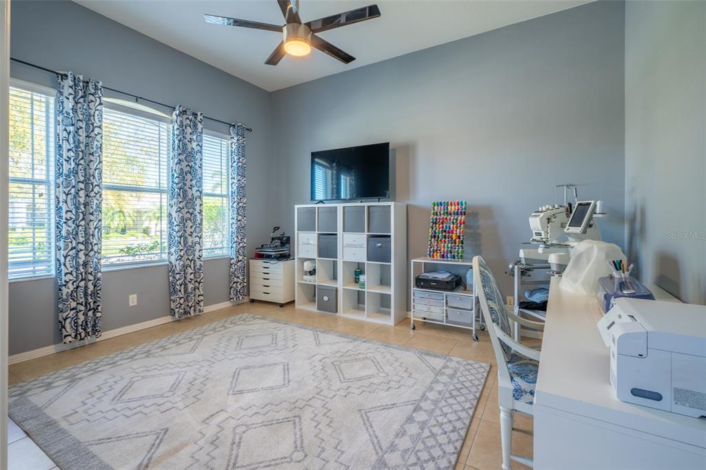 309 Royal Bonnet Drive Apollo Beach, FL 33572 - Photo 17 of 59 a bedroom with furniture and a flat screen tv