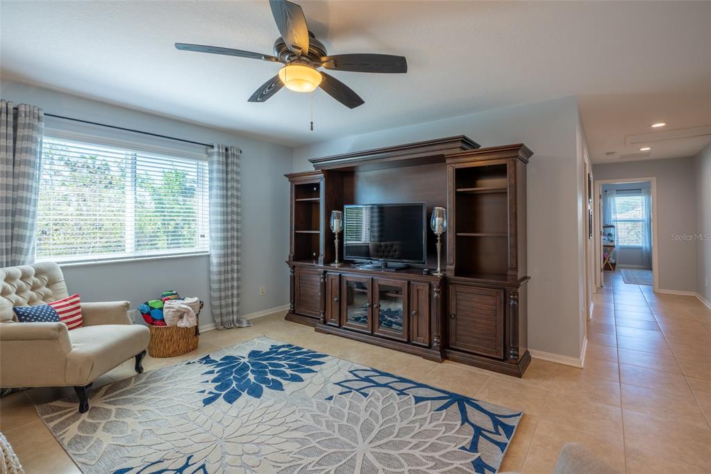 309 Royal Bonnet Drive Apollo Beach, FL 33572 - Photo 24 of 59 a living room with furniture and a flat screen tv