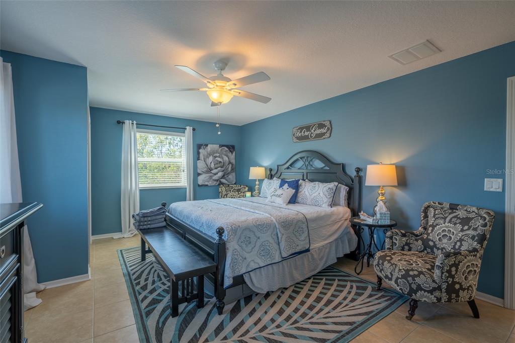 309 Royal Bonnet Drive Apollo Beach, FL 33572 - Photo 26 of 59 a bedroom with double bed and a window