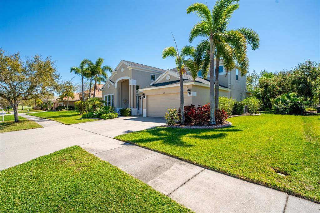 309 Royal Bonnet Drive Apollo Beach, FL 33572 - Photo 40 of 59 a front view of house with yard and green space