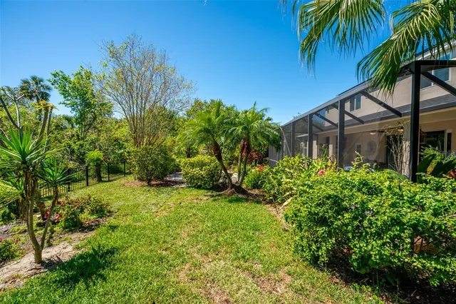 a aerial view of a house with a yard and garden