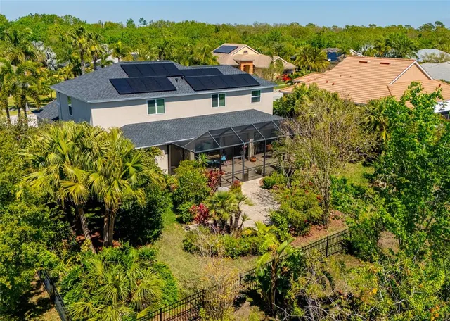 a view of a swimming pool and lounge chairs
