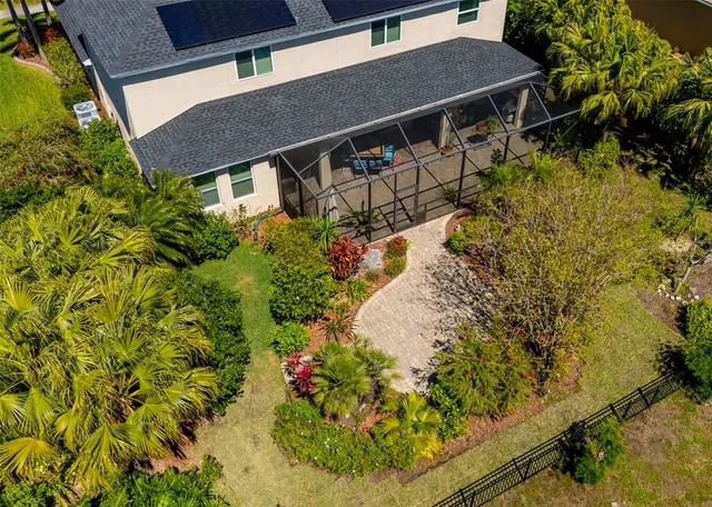 a view of a lake with houses in the background