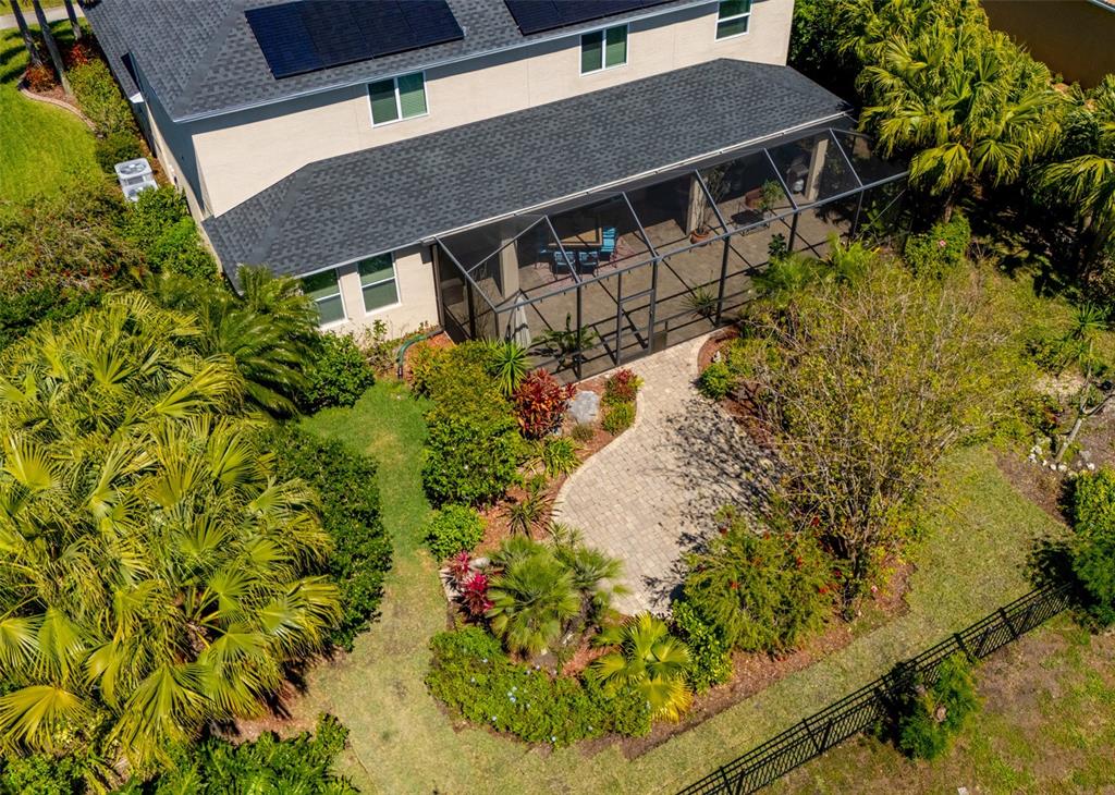 309 Royal Bonnet Drive Apollo Beach, FL 33572 - Photo 48 of 59 a aerial view of a house with a yard and garden