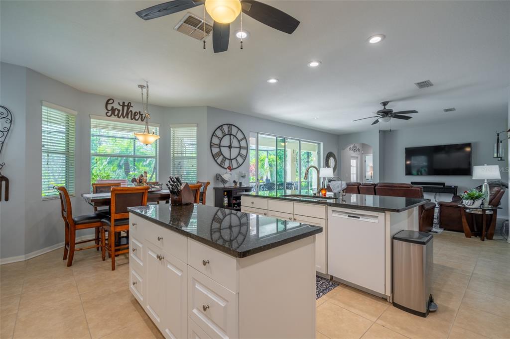 309 Royal Bonnet Drive Apollo Beach, FL 33572 - Photo 10 of 59 a kitchen with sink stove and living room
