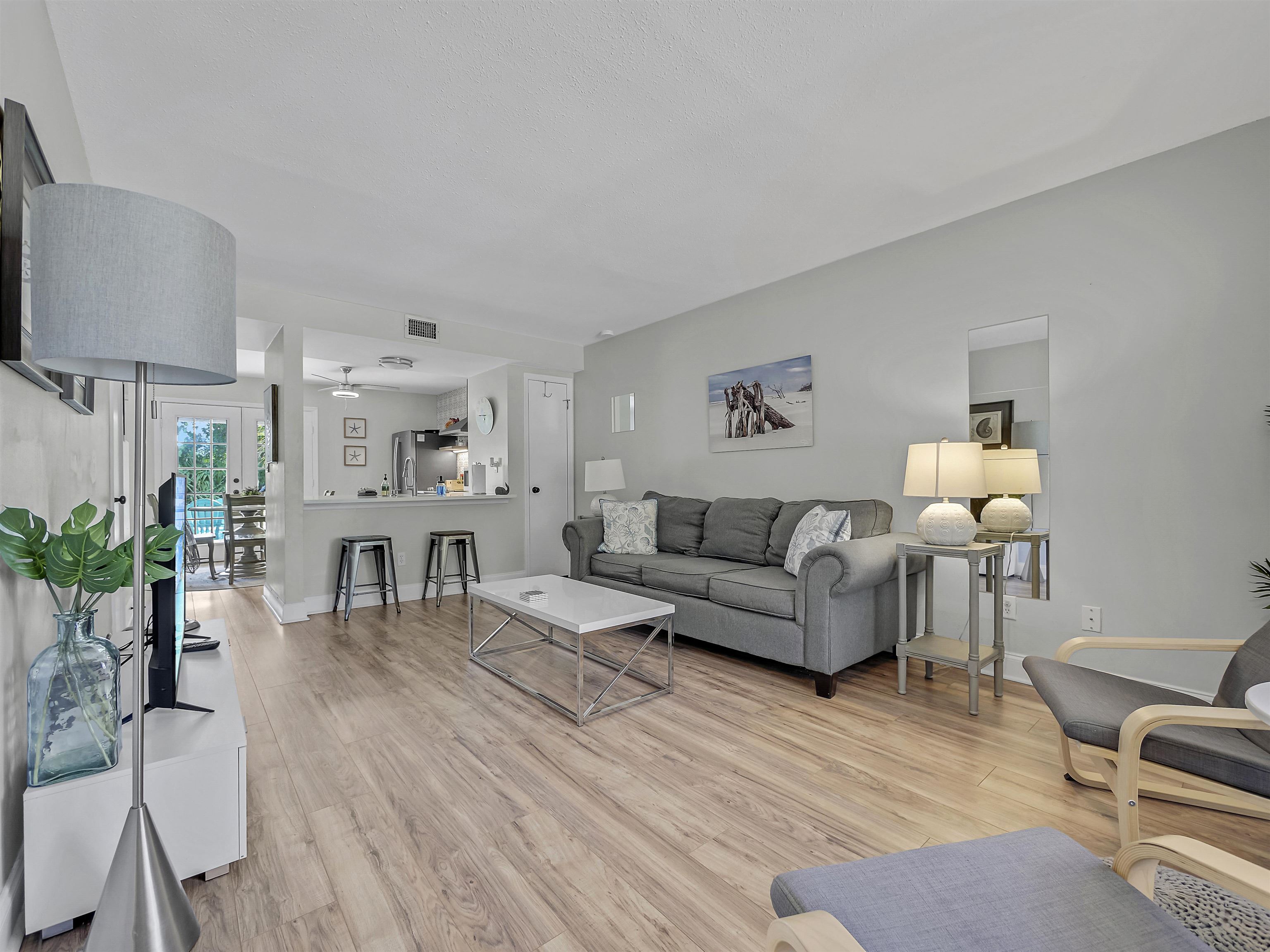 6444 Madison Street St. Augustine, FL 32080 - Photo 11 of 36 a living room with furniture and a flat screen tv