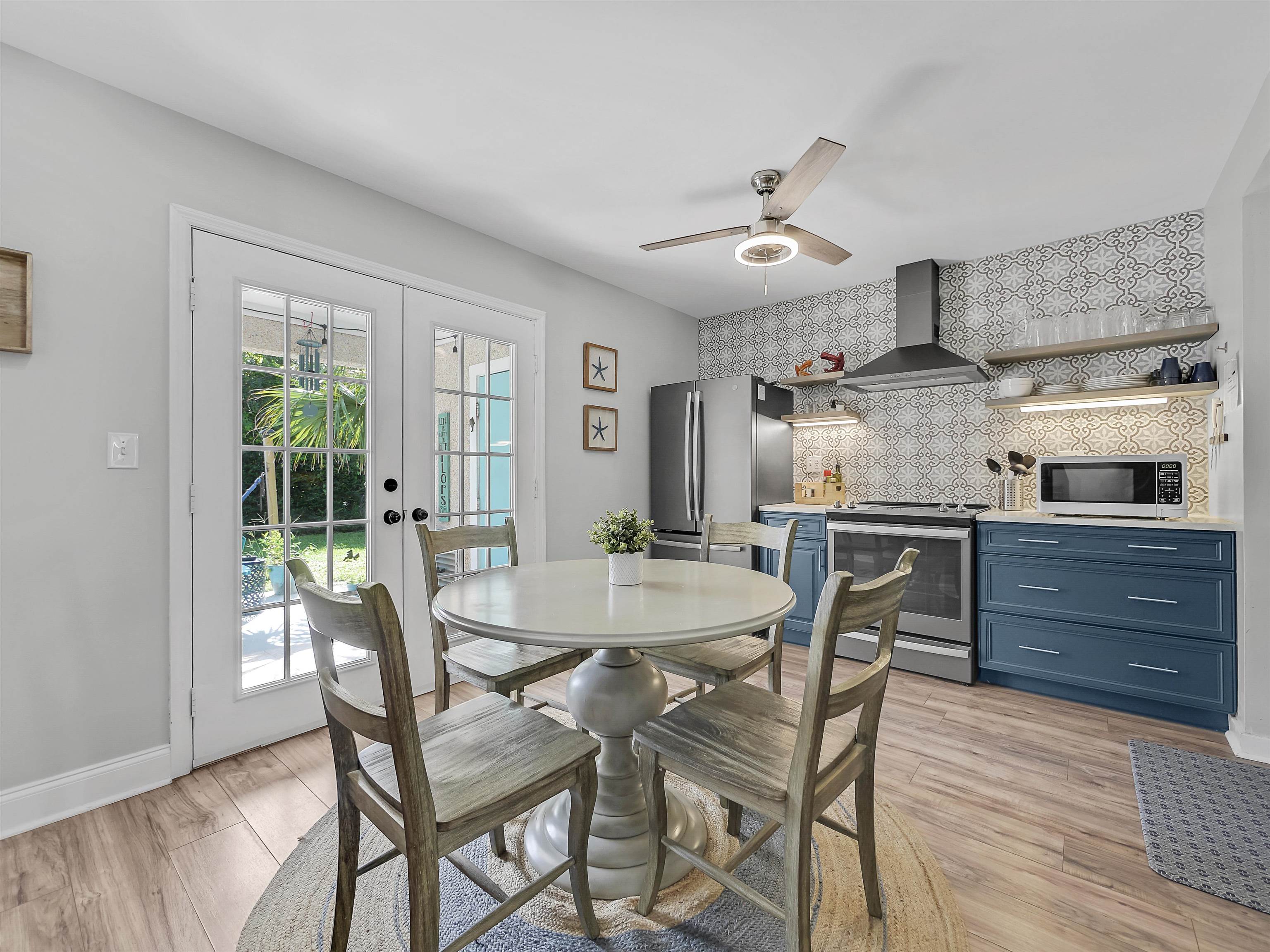 6444 Madison Street St. Augustine, FL 32080 - Photo 16 of 36 a view of a dining room with furniture window and wooden floor
