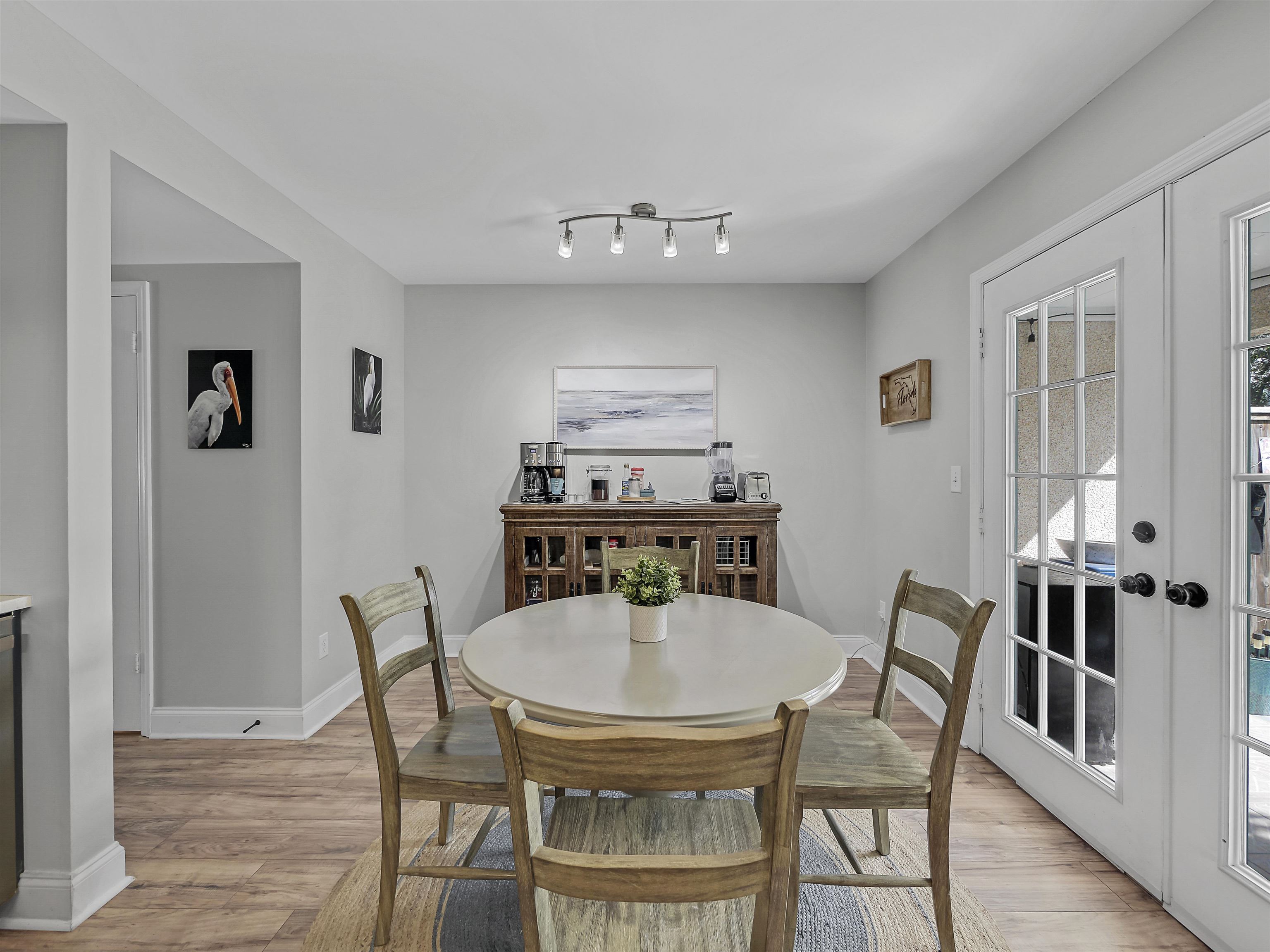 6444 Madison Street St. Augustine, FL 32080 - Photo 18 of 36 a view of a dining room with furniture and wooden floor