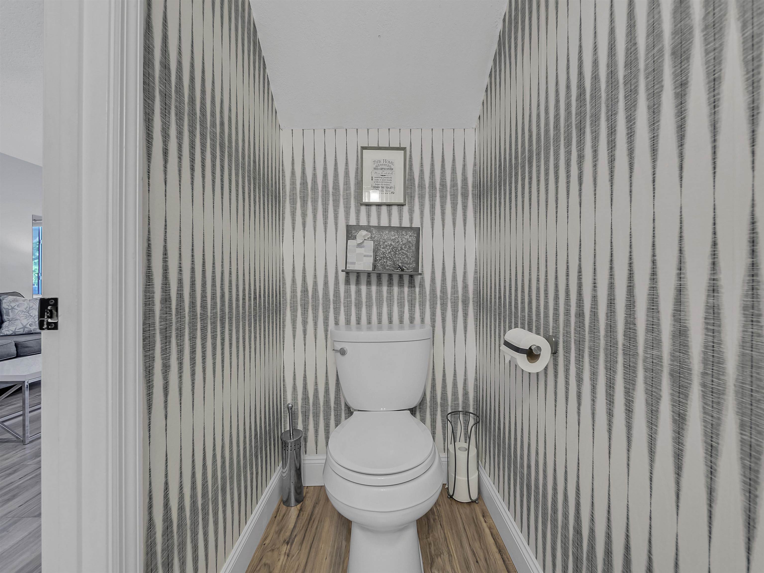 6444 Madison Street St. Augustine, FL 32080 - Photo 20 of 36 a bathroom with a toilet and a sink