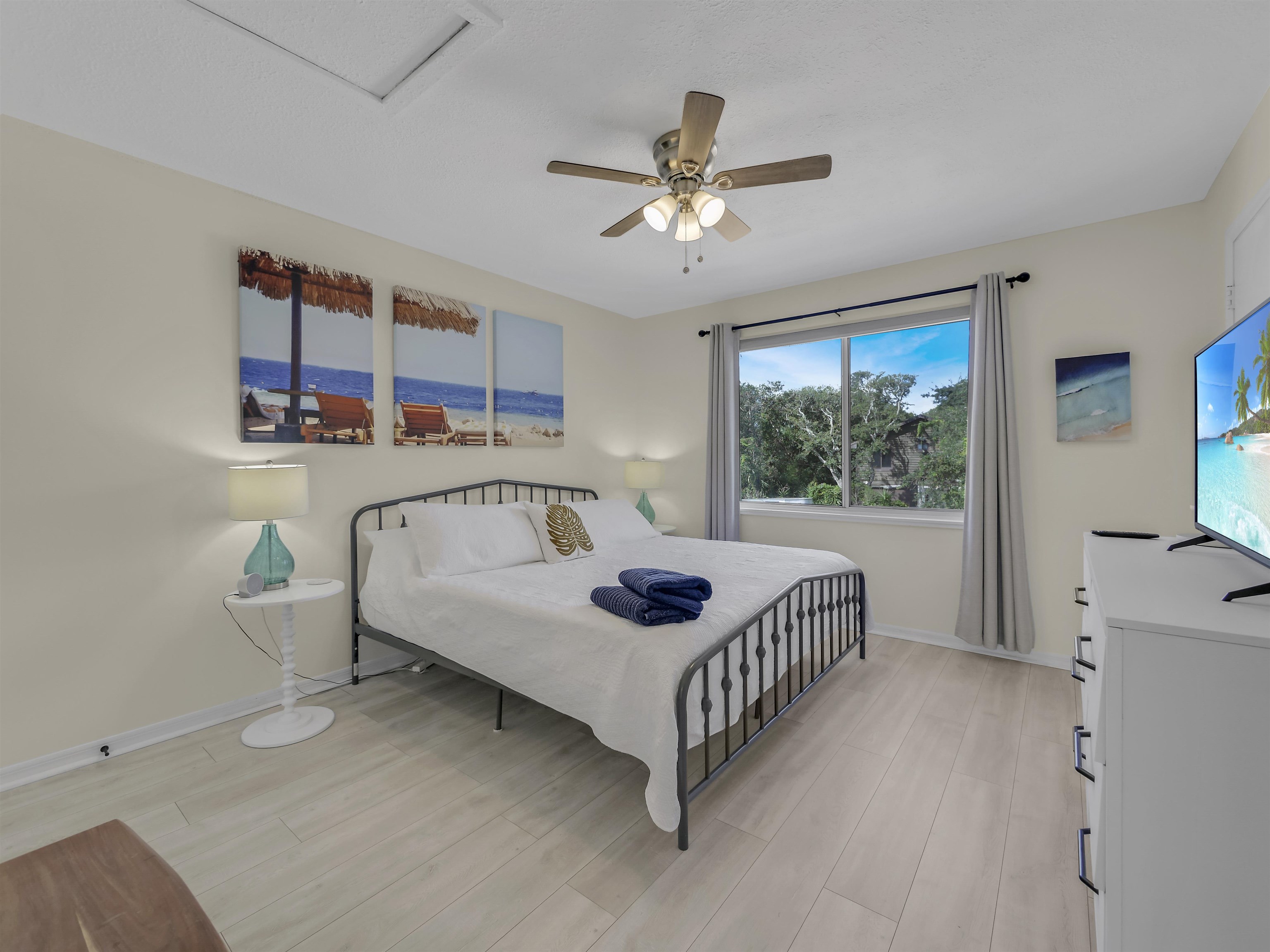 6444 Madison Street St. Augustine, FL 32080 - Photo 23 of 36 a bed room with a bed and a chandelier