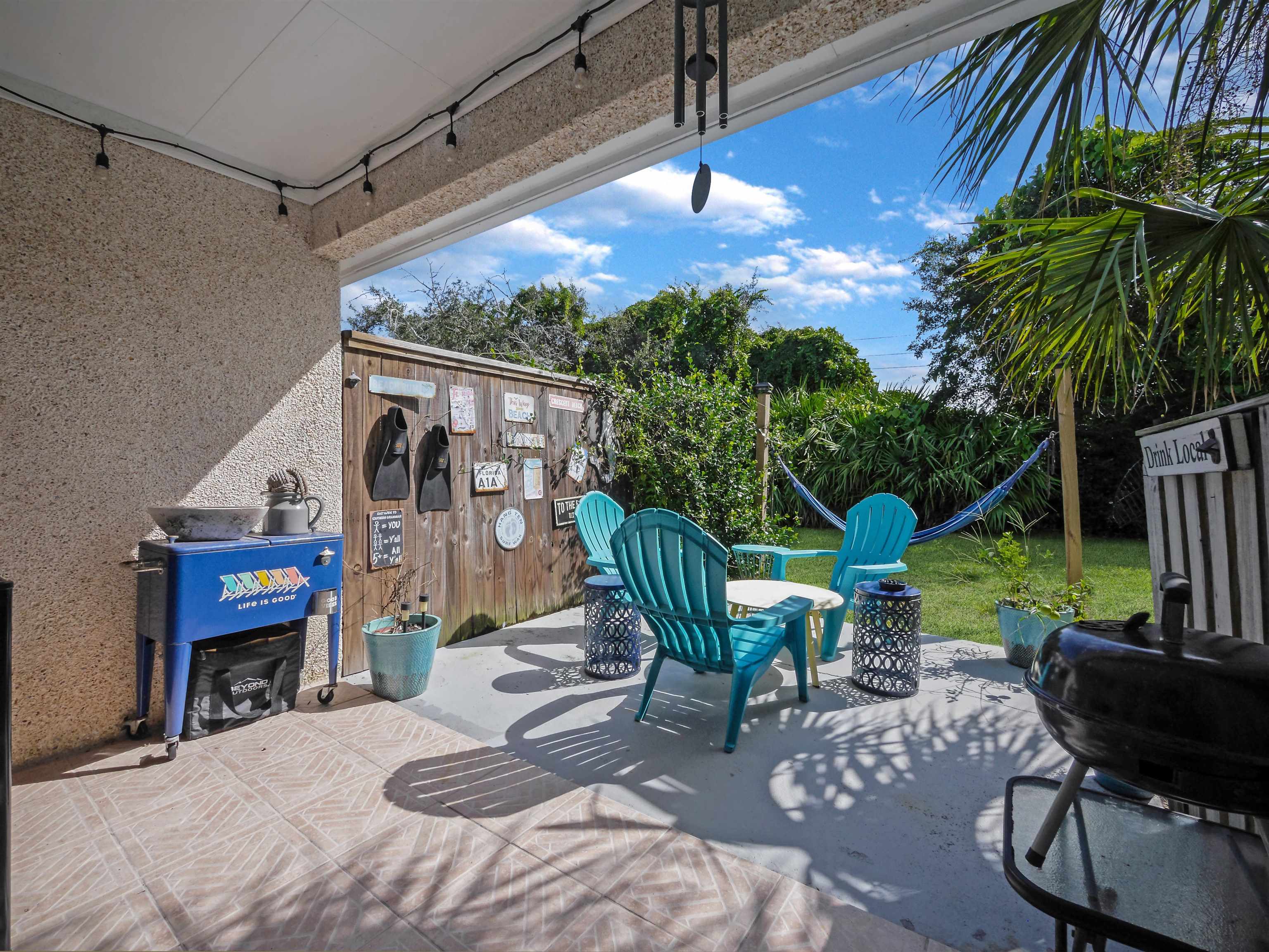 6444 Madison Street St. Augustine, FL 32080 - Photo 30 of 36 a view of a chairs and table in a patio