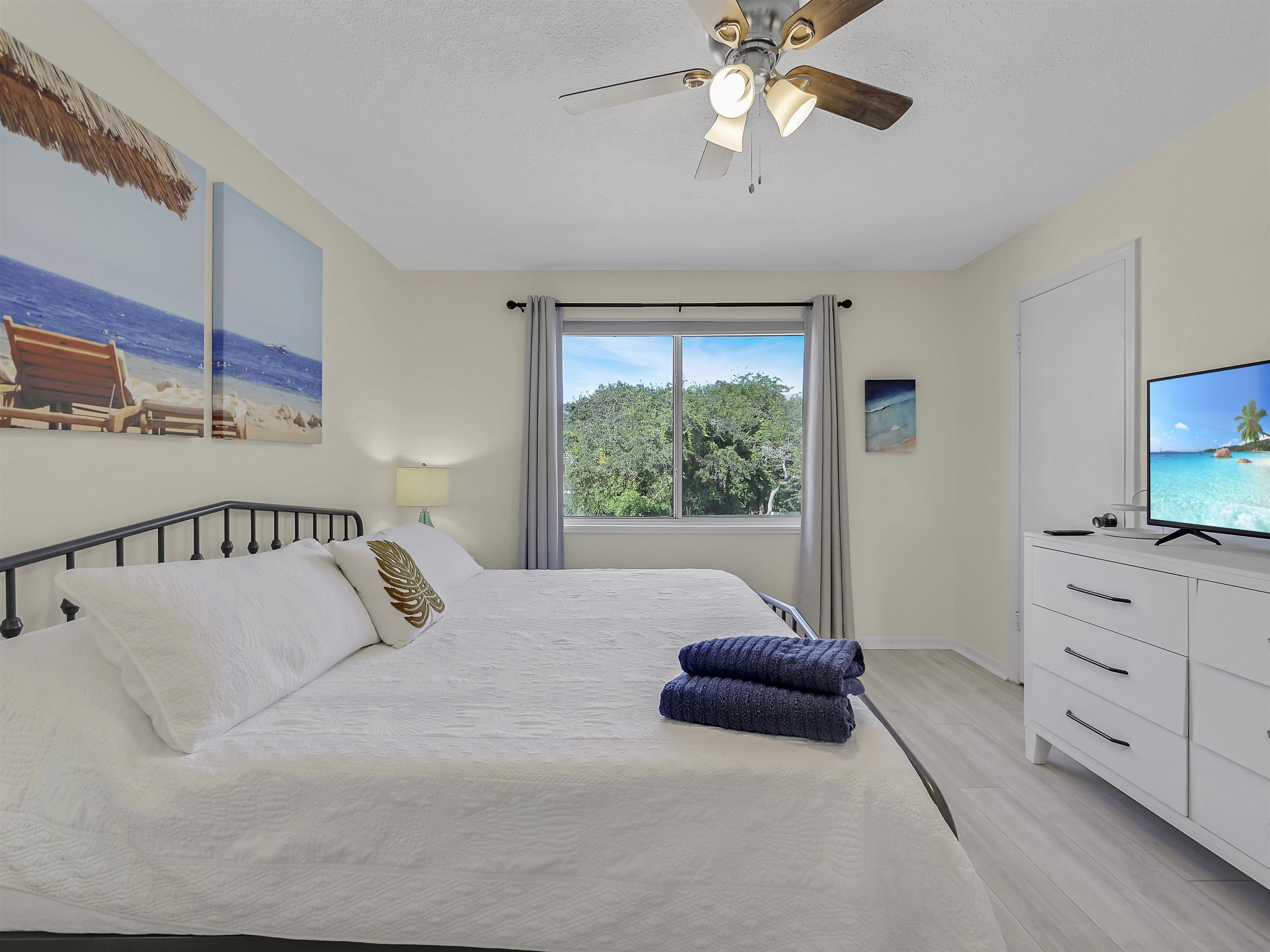 6444 Madison Street St. Augustine, FL 32080 - Photo 3 of 36 a bedroom with a bed and a chandelier