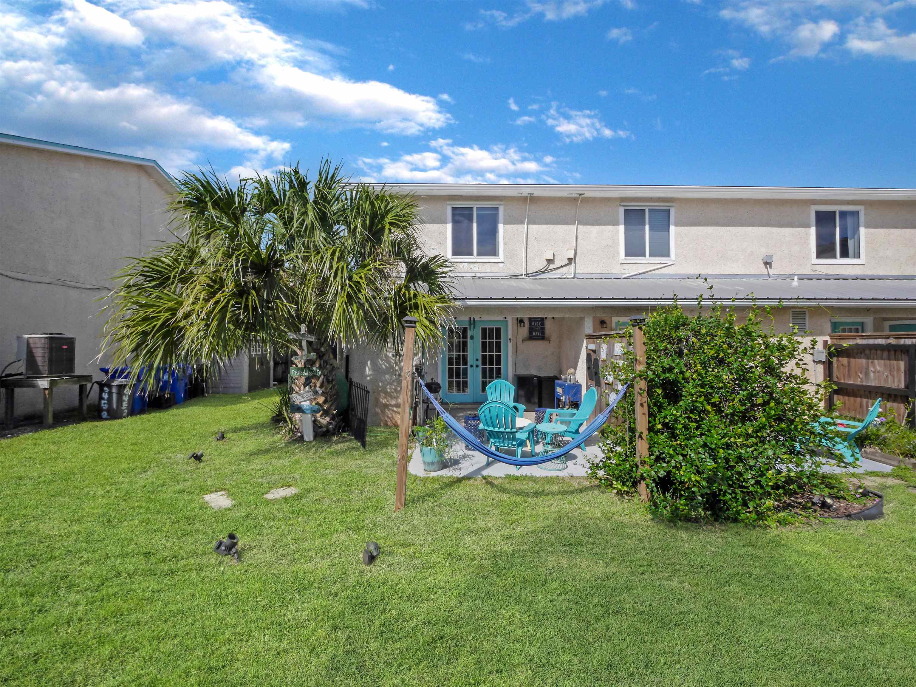 6444 Madison Street St. Augustine, FL 32080 - Photo 31 of 36 a view of a house with a yard porch and sitting area