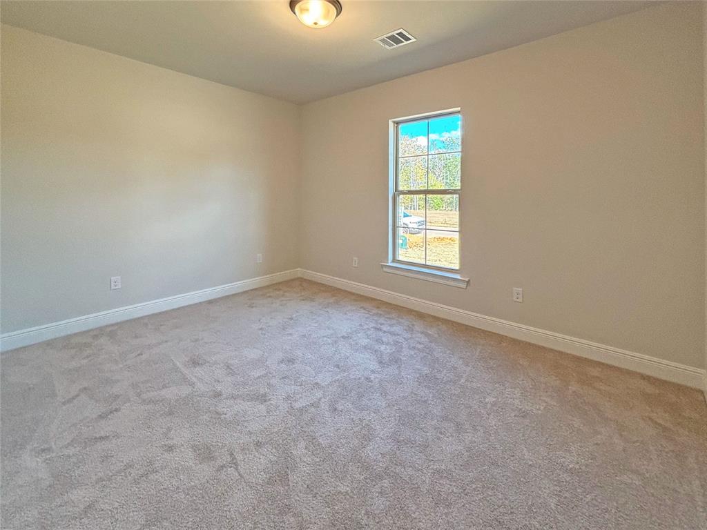 406 Hummingbird Lane Princeton, LA 71067 - Photo 11 of 25 an empty room with windows