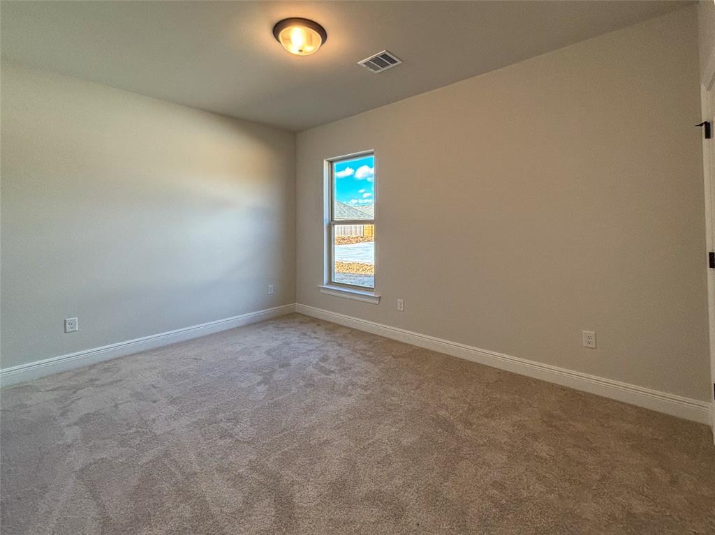 406 Hummingbird Lane Princeton, LA 71067 - Photo 13 of 25 an empty room with window and stairs