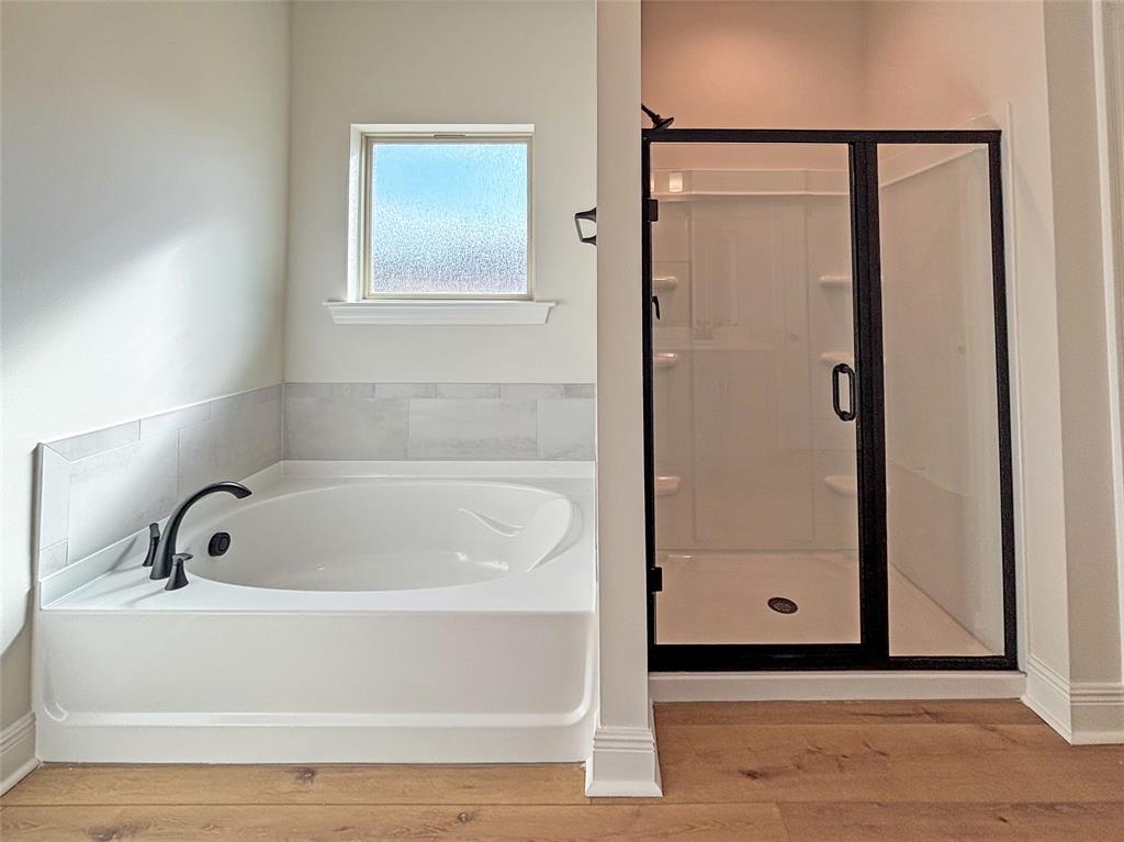 406 Hummingbird Lane Princeton, LA 71067 - Photo 20 of 25 a bathroom with a tub and shower