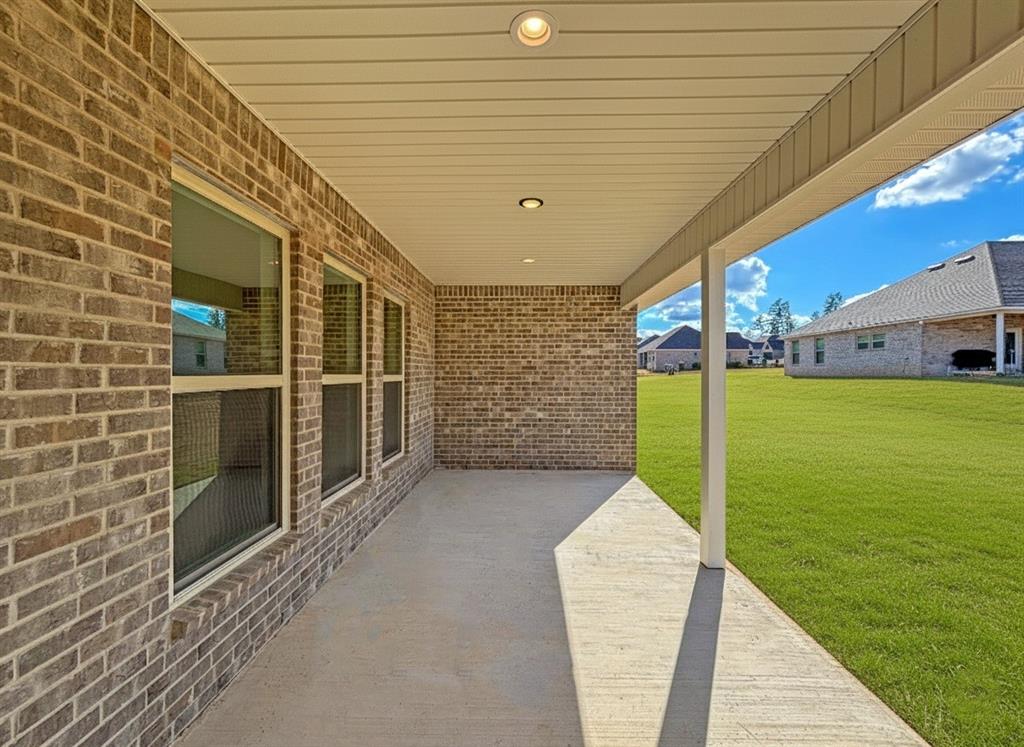 406 Hummingbird Lane Princeton, LA 71067 - Photo 23 of 25 a view of a porch with a garden