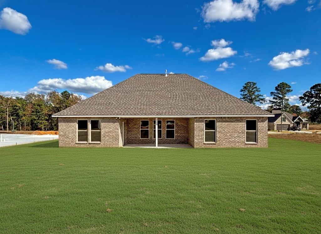 406 Hummingbird Lane Princeton, LA 71067 - Photo 24 of 25 a front view of a house with a garden