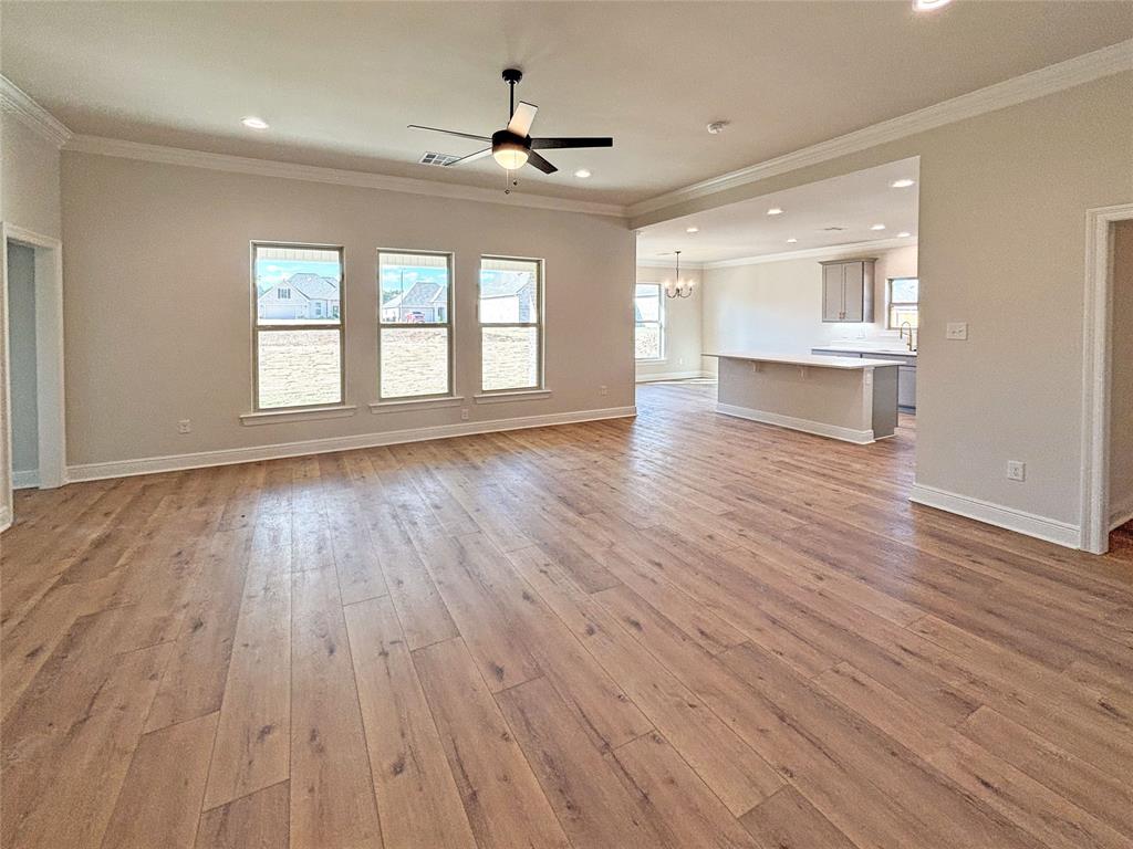 406 Hummingbird Lane Princeton, LA 71067 - Photo 3 of 25 a view of an empty room with wooden floor and a window
