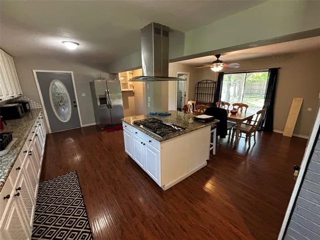 a kitchen with table and chairs