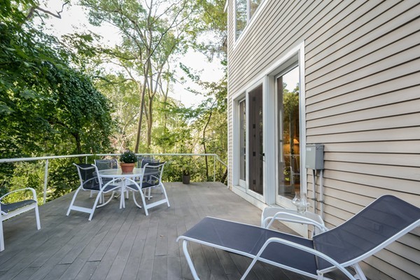 354 Woodland Road Brookline, MA 02467 - Photo 4 of 30 a patio with wooden floor and outdoor seating