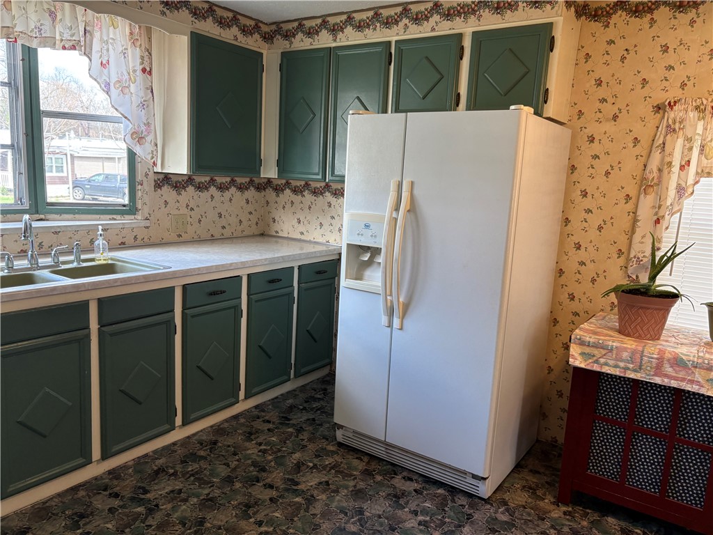 5434 North Waynesville Road, Unit 15 Oregonia, OH 45054 - Photo 13 of 19 This cozy kitchen offers functional space with ample cabinetry and essential appliances.