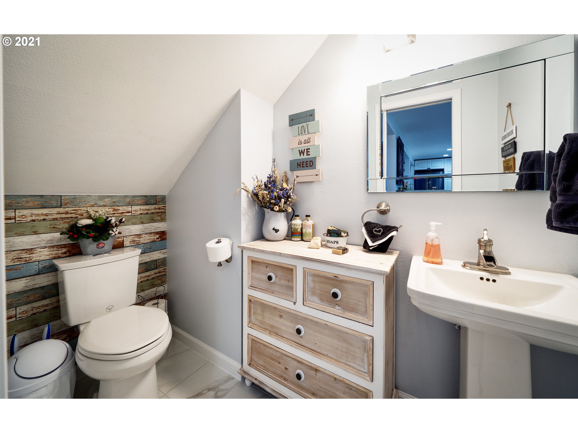 497 71st Street Springfield, OR 97478 - Photo 11 of 32 a bathroom with a sink vanity mirror and toilet