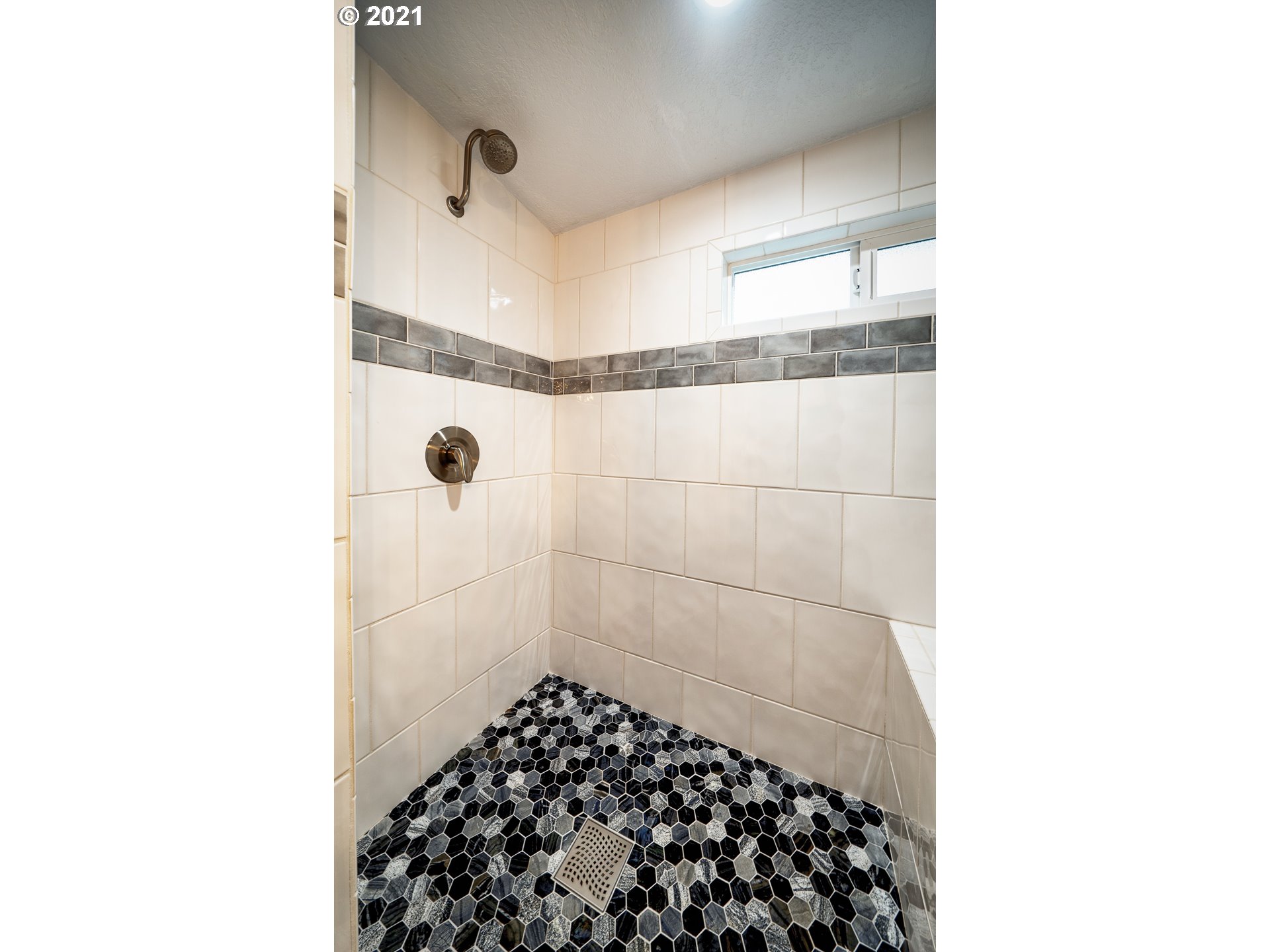 497 71st Street Springfield, OR 97478 - Photo 17 of 32 a bathroom with a glass door shower