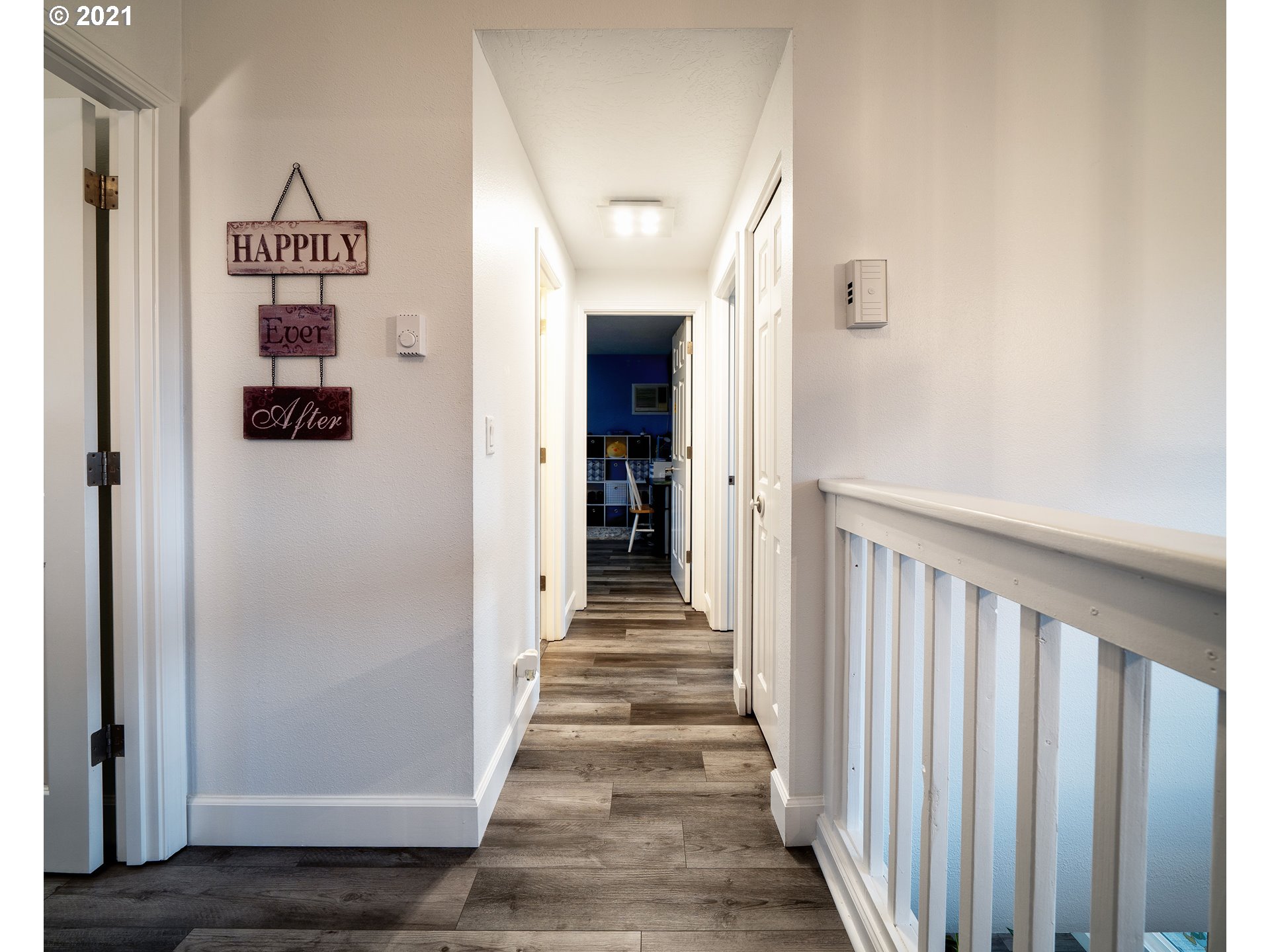 497 71st Street Springfield, OR 97478 - Photo 18 of 32 a view of a hallway with wooden shelves