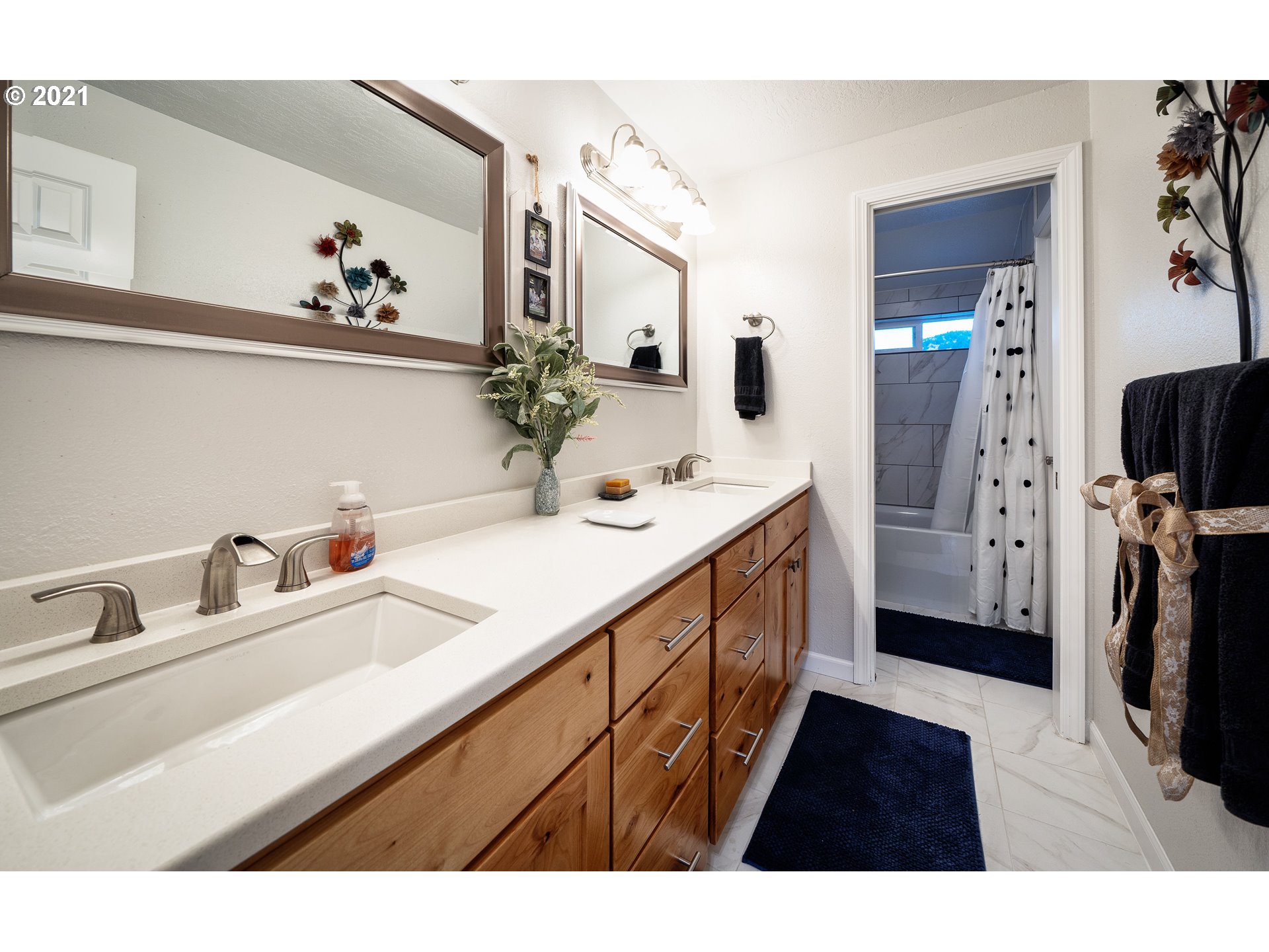 497 71st Street Springfield, OR 97478 - Photo 22 of 32 a en suite bathroom with a sink double vanity