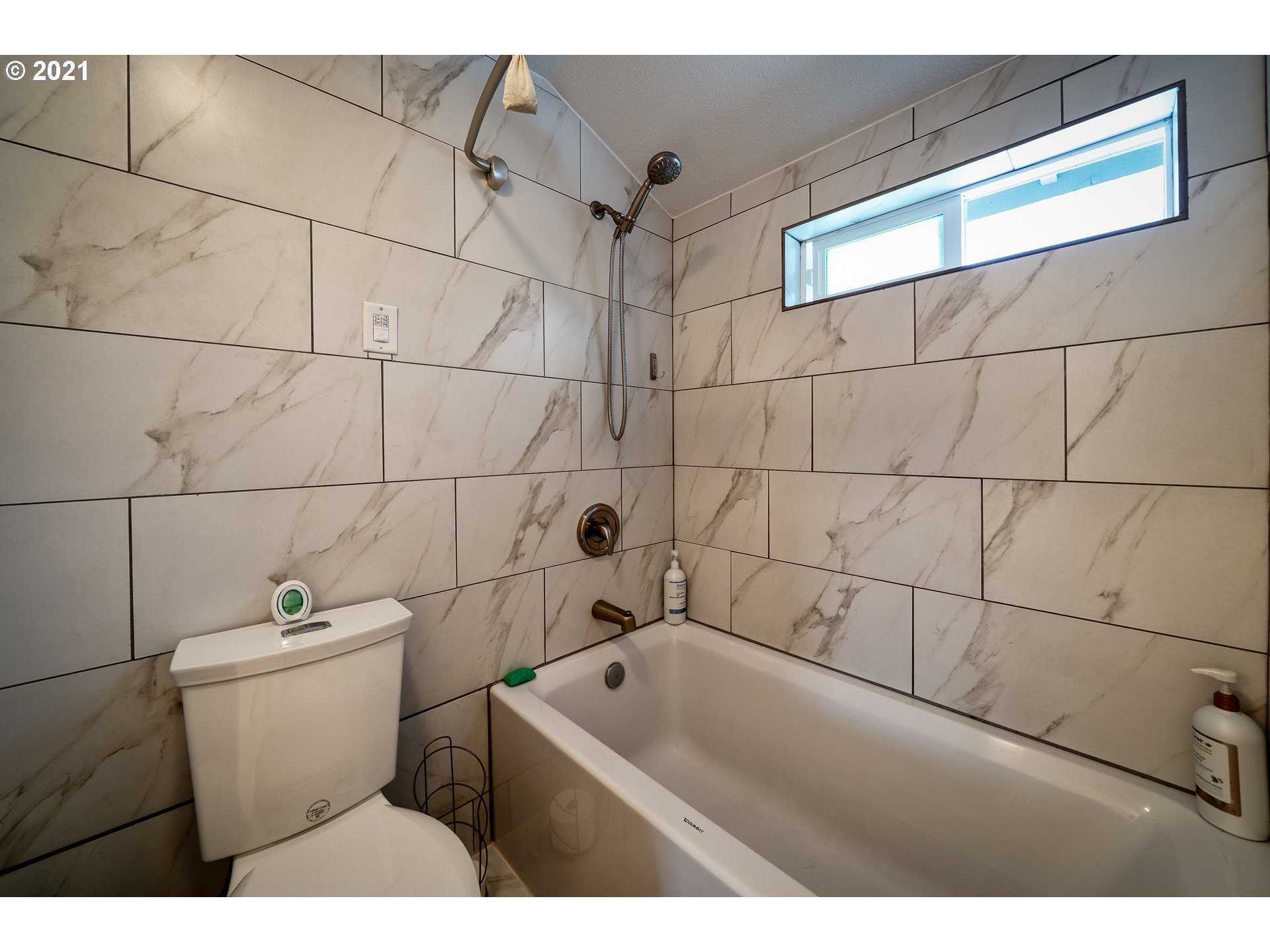 497 71st Street Springfield, OR 97478 - Photo 23 of 32 a bathroom with a sink and toilet