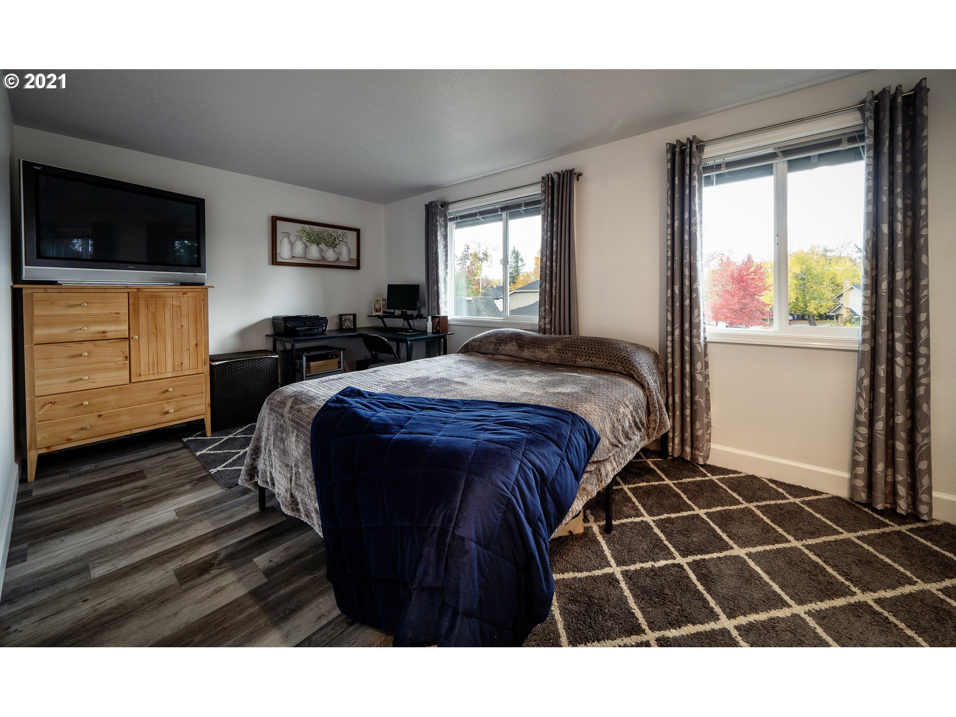 497 71st Street Springfield, OR 97478 - Photo 24 of 32 a bedroom with a bed and a window