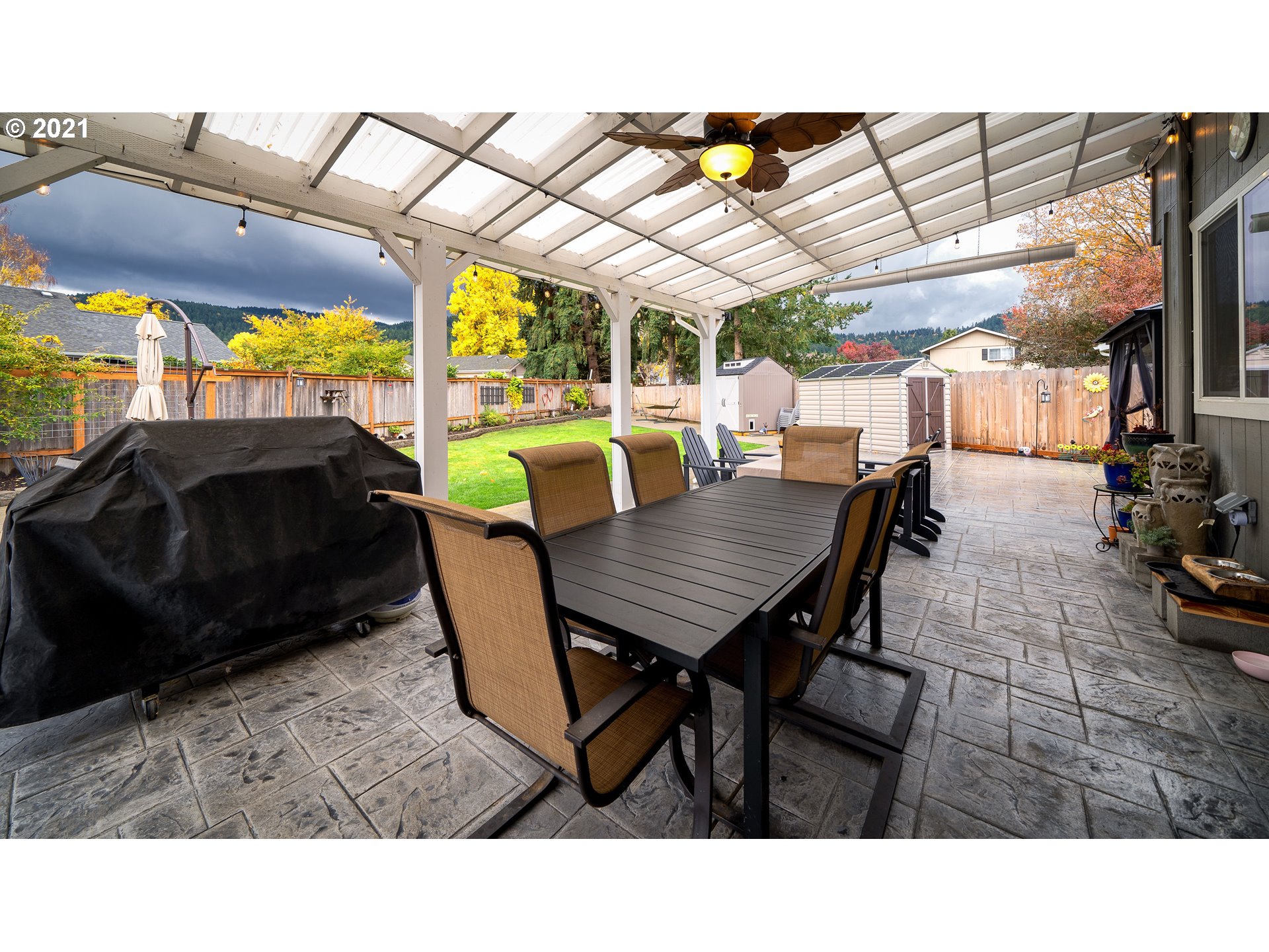 497 71st Street Springfield, OR 97478 - Photo 26 of 32 a backyard of a house with table and chairs