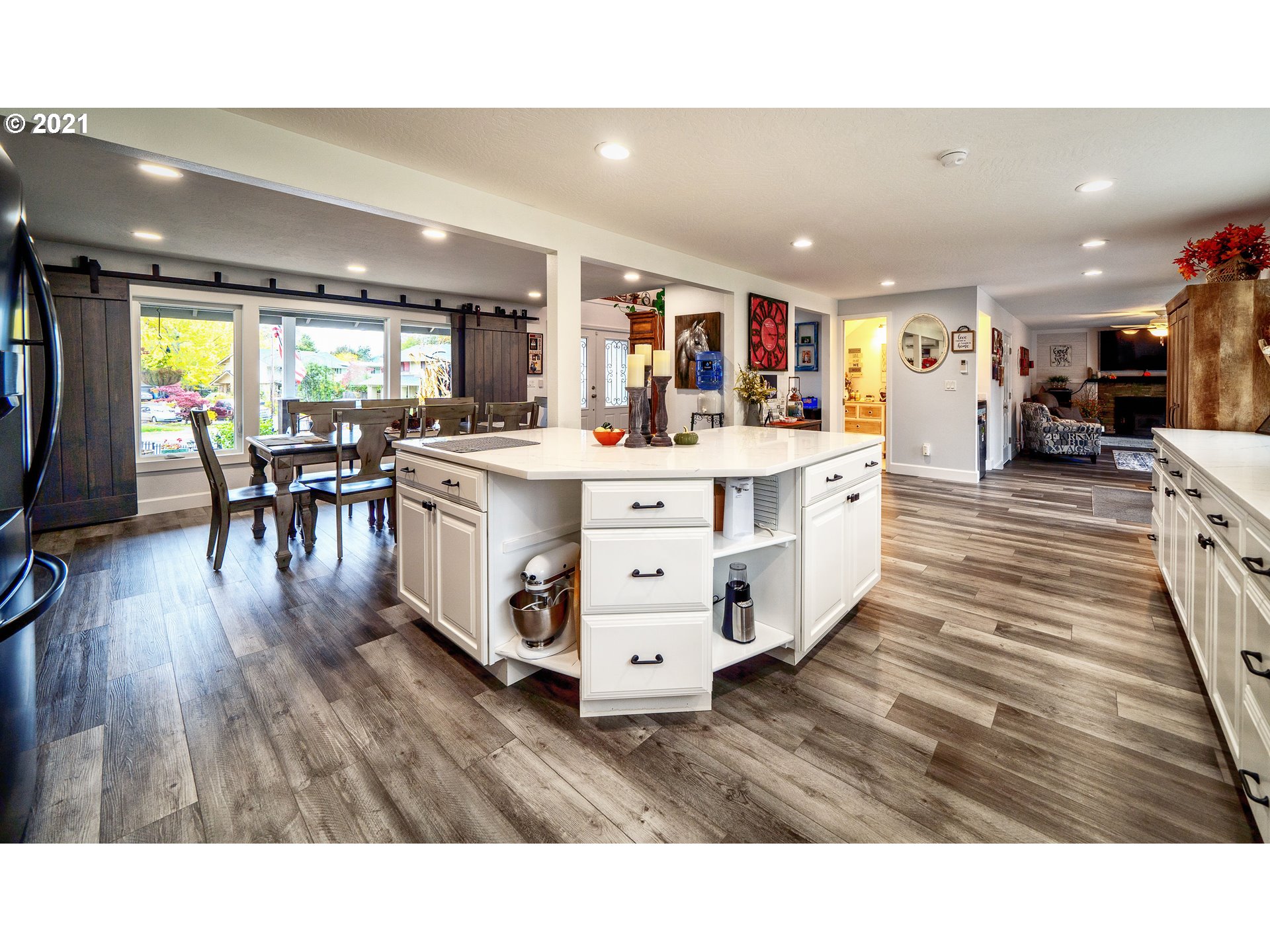 497 71st Street Springfield, OR 97478 - Photo 10 of 32 a living room with stainless steel appliances furniture and a wooden floor