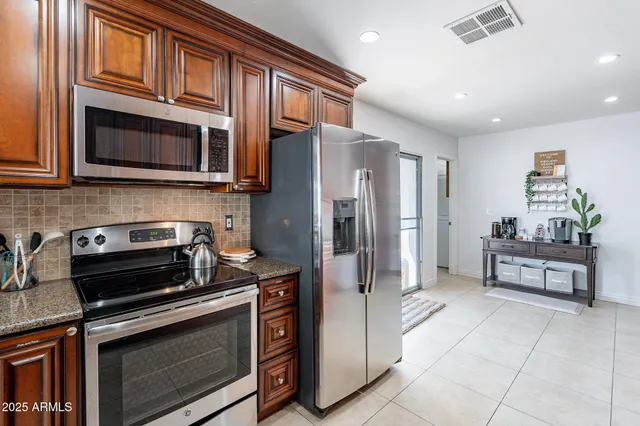 a view of a dining room with furniture and a window