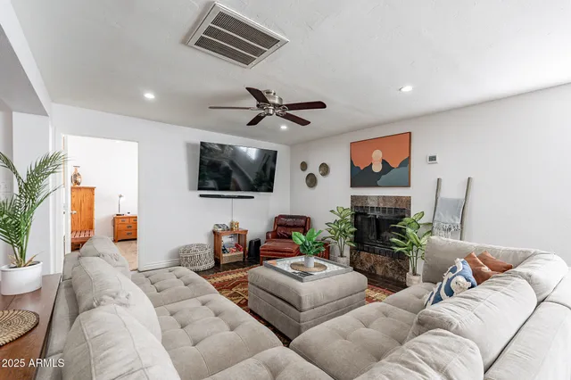 a room with pool table and a chandelier