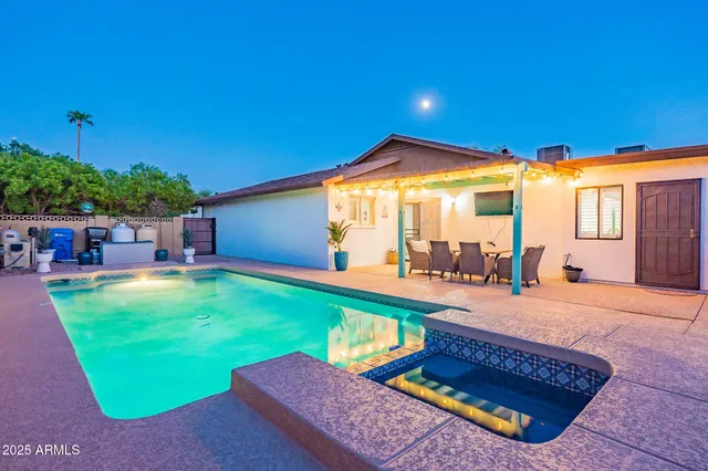 a view of an chairs and table in the patio