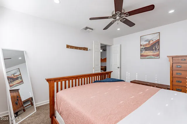 a bathroom with a shower a mirror and a shower