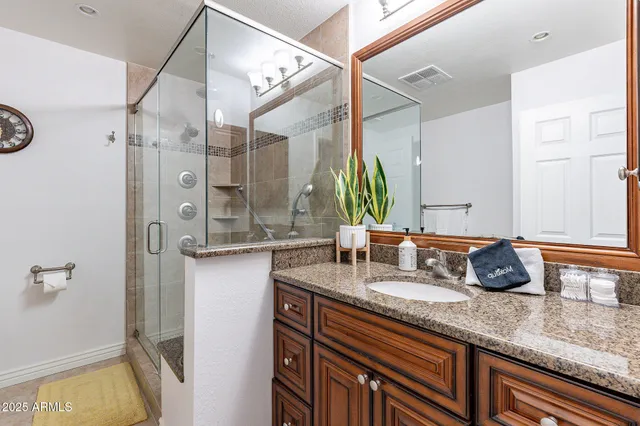 a bedroom with a bed and chair