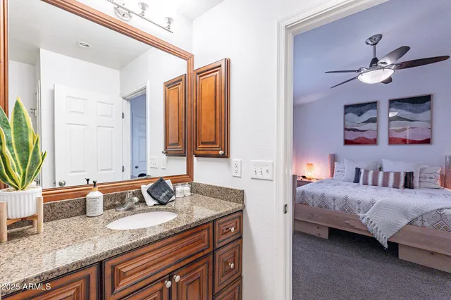 a bedroom with furniture and a window