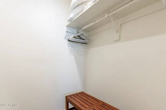 a view of a house with swimming pool and sitting area