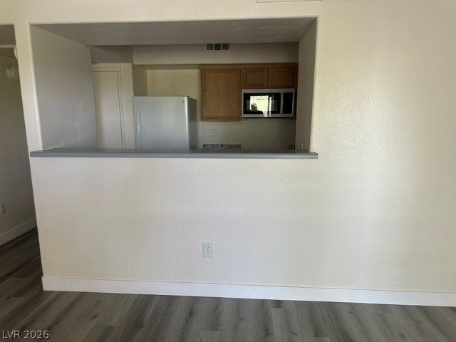 7255 West Sunset Road, Unit 2006 Las Vegas, NV 89113 - Photo 6 of 24 A well-appointed kitchen peeks through a practical pass-through window.