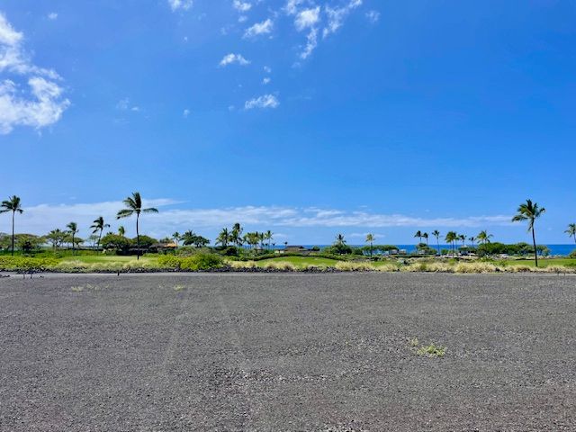 a view of a big and white house